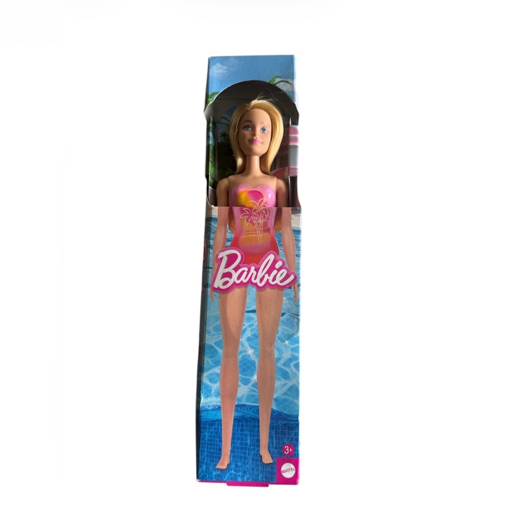 MATTEL 2023 Beach Barbie Doll Blond Hair Wearing Pink Palm Tree-Print Swimsuit